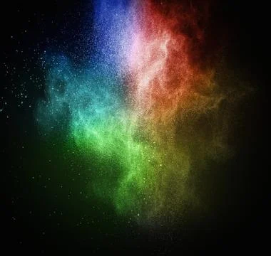 Colourful powder exploding isolated on black 写真素材