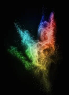 Colourful powder exploding isolated on black Stock Photos
