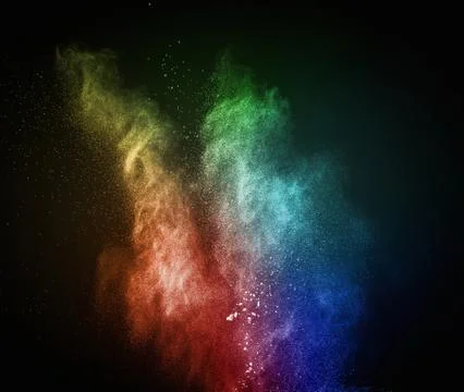 Colourful powder exploding isolated on black 写真素材