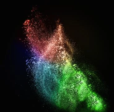 Colourful powder exploding isolated on black 库存照片