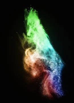 Colourful powder exploding isolated on black 写真素材