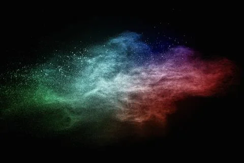 Colourful powder exploding isolated on black Stock Photos