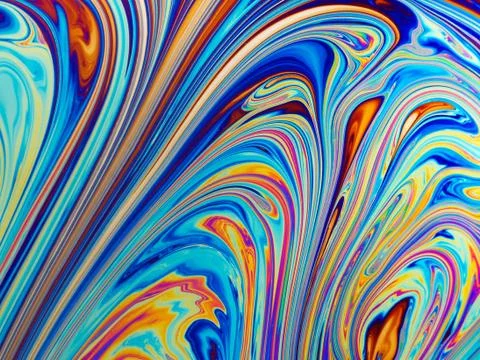 Colourful psychedelic soap bubble refractions pattern macro. Stock Photos