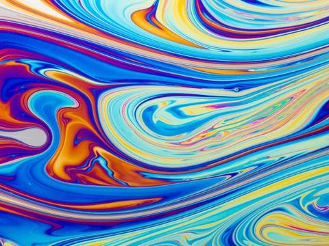Colourful psychedelic soap bubble refractions pattern macro. Stock Photos