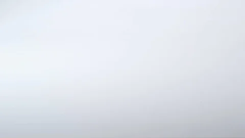 Colourful push pins roll  into frame on a white surface Stock Footage 117350188