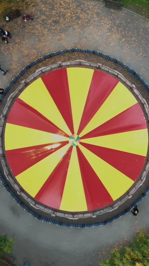 Colourful, red and yellow carousel, a carnival Merry Go Round, in the autumn Stock Footage 318351759