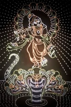 Colourful representation of god krishna using led lights Stock Photos