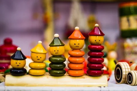 Colourful ring toy stacking doll figures with increasing sizes Stock Photos