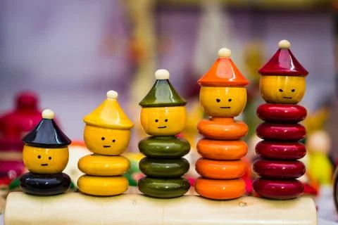 Colourful ring toy stacking doll figures with increasing sizes Stock Photos