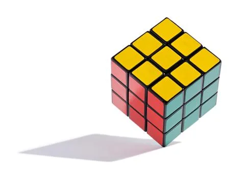 Colourful rubiks cube balanced on edge Illustrazione stock
