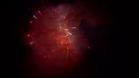 A colourful spectacle of fireworks igniting the night sky Stock Footage 239442847
