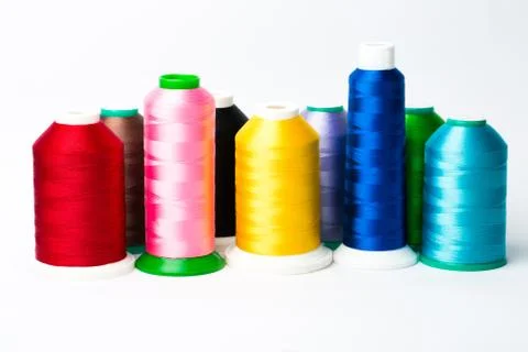 Colourful spools of thread on white background Stock Photos