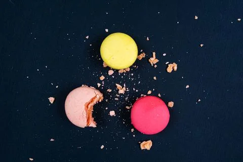Colourful stack of macaroons isolated on plain black background. Copyspace Stock Photos