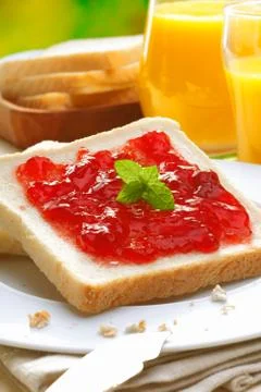 Colourful strawberry preserve on bread Stock Photos