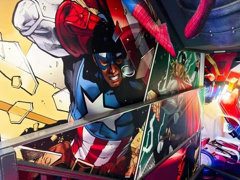 Colourful superhero comic mural featuring Captain America and Thor on a sta.. Stock Photos