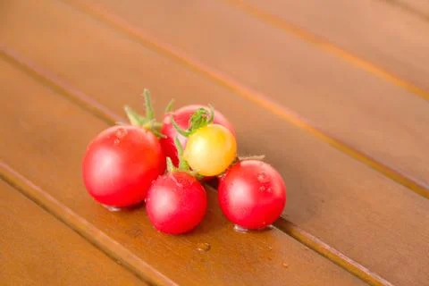 Colourful tomatoes on a table Stock Photos
