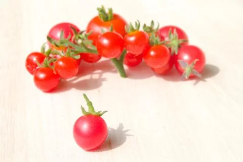 Colourful tomatoes on a table Stock Photos