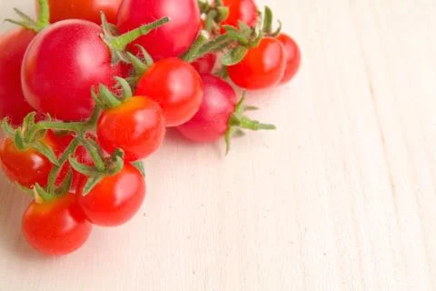 Colourful tomatoes on a table Stock Photos