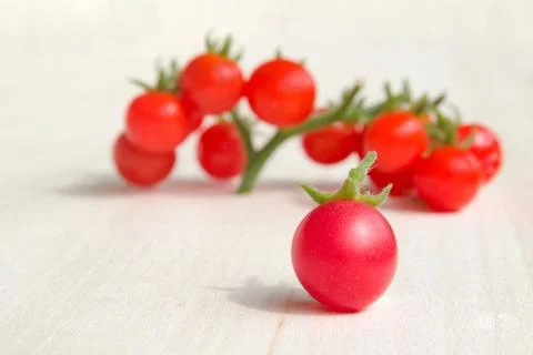 Colourful tomatoes on a table Stock Photos