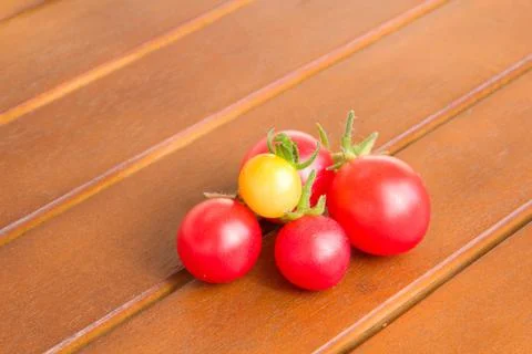Colourful tomatoes on a table Stock Photos