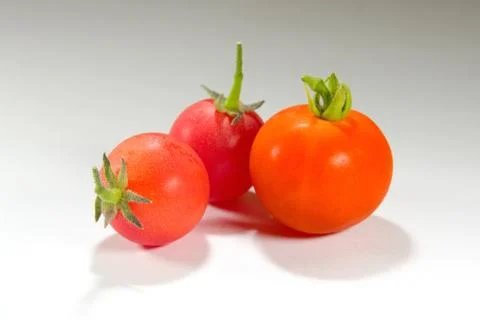 Colourful tomatoes on a table Stock Photos