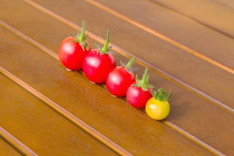 Colourful tomatoes on a table Stock Photos