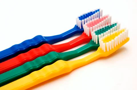 Colourful toothbrushes Stock Photos