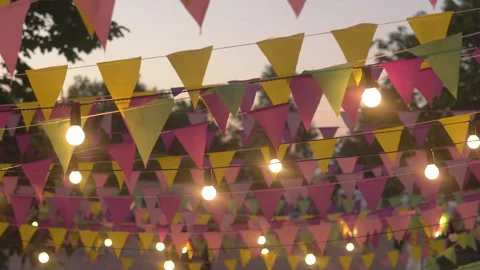 Colourful triangular flags hanging in the sky at an outdoor celebration party. Video stock 92450409
