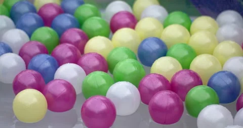 Colourfull Balls Floating on Water Surface of a Swimming Pool Stock Footage 64767297