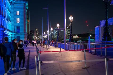 Colourfully lit night scene between The London Eye and County Hall Stock Photos