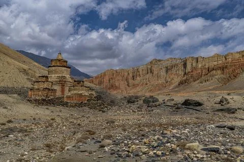 Colourfully painted Buddhist stupa, in a eroded mountain landscape, Kingdom of 스톡 사진