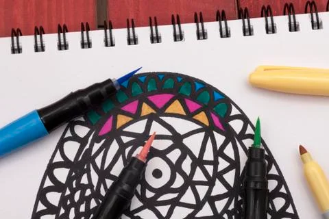 Colouring a mandala Stock Photos