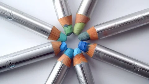 Colouring pencil tips rotating in a circle against a white background Stock Footage 115670074