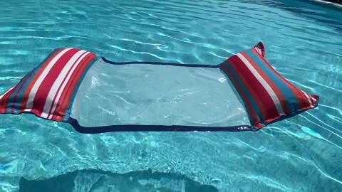 Colrful pool float in swimming pool Stock Footage 311408517