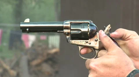 Colt 45 pistol shoots and fires aiming gun Stock Footage 62935853