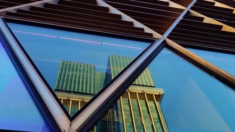 Columbus Towers reflected on the facade of a building. Madrid. Vídeos de archivo 298362328