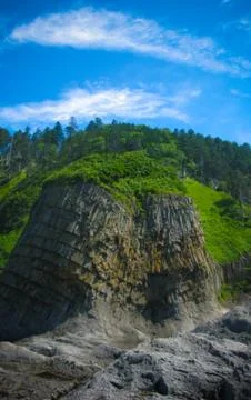 Column basalts formation of Stolbchaty cape at Kunashir, kuril islands, Russi Stock Photos
