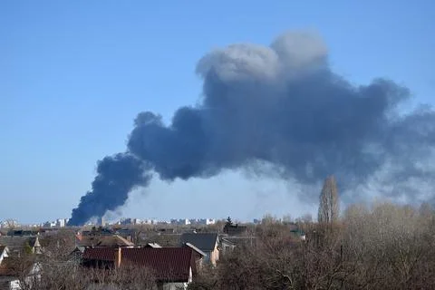 A column of black smoke from a fire. Stock Photos