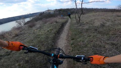 The column of cyclists rides mountain bikes. From the first person. Stock Footage 151547196
