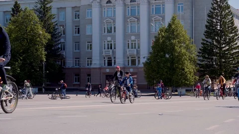 A column of cyclists rides through the city Stock Footage 108897229