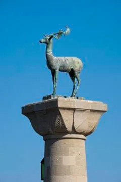 Column with deer heraldic animal of Rhodes entrance to the ancient Mandraki Stock Photos