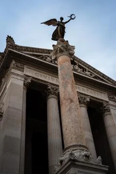 Column in front of the monumental palace dedicated to Vittorio Emanuele II in Stock Photos