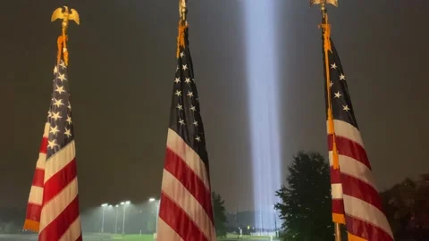 A column of light extends skyward in honor of 9/11 victims, at the Pentagon Stock Footage 144632749