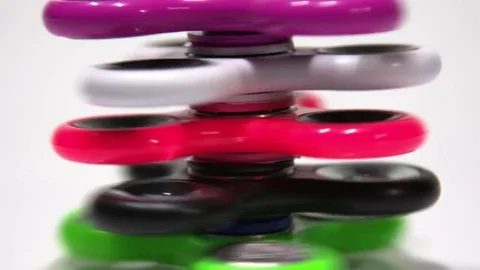 A column of several spinners revolves on a white background. Stock Footage 77739077
