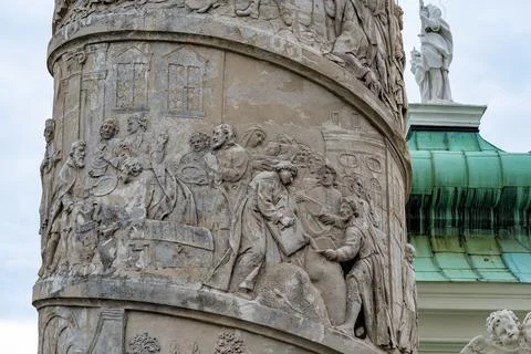 Column with spiral narrative in front of Karlskirche baroque church in Karl.. Stock Photos