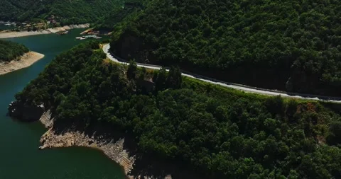 Column Of Vehicles Driving After Bus On Curved Dangerous Road With Forbidden Stock Footage 300490387