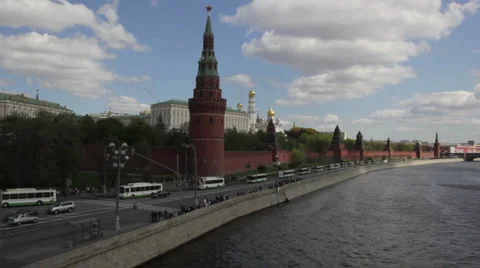 Column of white buses and walking Stock Footage 5615749