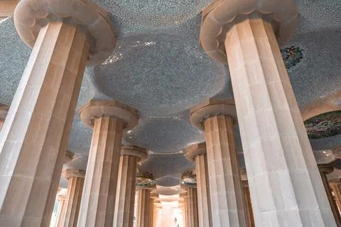 Columns and ceiling in Park Guell designed with details and precision Stock Photos