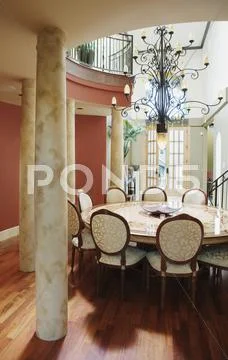 Columns and large round table Stock Photos