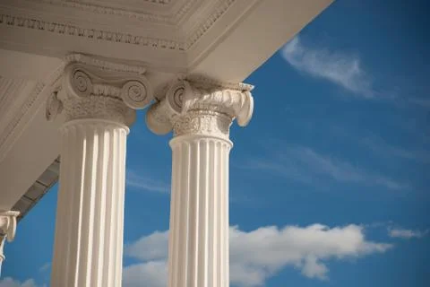 Columns on blue sky background. Stock Photos